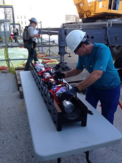 A GEH technician prepares the ultrasonic inspection robot for deployment into an underground pipe at South Texas Project.